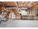 Unfinished basement workshop with multiple workbenches at 2041 Democracy Dr, Buford, GA 30519