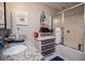 Well-lit bathroom featuring a shower, granite countertops, vanity and decorative mirror at 706 Berry Ct, Villa Rica, GA 30180