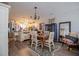 Bright and open kitchen with stainless steel appliances, white cabinetry, and a cozy dining area at 706 Berry Ct, Villa Rica, GA 30180