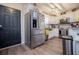 Well-equipped kitchen featuring stainless steel appliances, white cabinetry, and a modern design for cooking convenience at 706 Berry Ct, Villa Rica, GA 30180