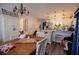 Charming kitchen area featuring a rustic wooden dining table, a hutch, with stainless steel appliances in the background at 706 Berry Ct, Villa Rica, GA 30180