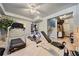 Basement gym with a treadmill, elliptical machine, weight bench, and ample storage at 125 Hillcrest Trce, Fayetteville, GA 30215