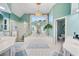 Luxurious bathroom with a large tub, chandelier, double vanity, and separate shower at 125 Hillcrest Trce, Fayetteville, GA 30215