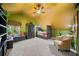 Unique bedroom featuring a sloped ceiling, ample seating, and plenty of natural light from the windows at 125 Hillcrest Trce, Fayetteville, GA 30215