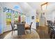 Bright breakfast nook with wood floors and view of deck at 125 Hillcrest Trce, Fayetteville, GA 30215