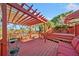 Spacious deck with pergola, seating, and steps leading to the yard at 125 Hillcrest Trce, Fayetteville, GA 30215