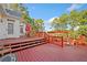Large deck with seating area, pergola, and stairs leading to the yard at 125 Hillcrest Trce, Fayetteville, GA 30215
