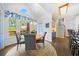 Bright dining area with deck access, complemented by natural light and stylish decor at 125 Hillcrest Trce, Fayetteville, GA 30215