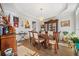 Bright dining room with hardwood floors, chandelier, and large table at 125 Hillcrest Trce, Fayetteville, GA 30215