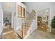 Grand foyer with staircase and hardwood floors create an inviting entrance at 125 Hillcrest Trce, Fayetteville, GA 30215