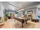 Game room with pool table, comfortable seating and plenty of natural light at 125 Hillcrest Trce, Fayetteville, GA 30215