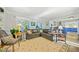 Gathering room with gray sectional sofa and view of kitchen at 125 Hillcrest Trce, Fayetteville, GA 30215