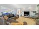Gathering room with gray sectional sofa and view into kitchen area at 125 Hillcrest Trce, Fayetteville, GA 30215