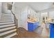 Kitchen features blue cabinetry and hardwood floors at 125 Hillcrest Trce, Fayetteville, GA 30215