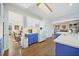 Open kitchen with island, blue cabinets and stainless steel appliances at 125 Hillcrest Trce, Fayetteville, GA 30215