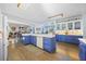 Open kitchen featuring hardwood floors, blue lower cabinets and white upper cabinets, and a bright, airy feel at 125 Hillcrest Trce, Fayetteville, GA 30215