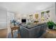 Spacious living area with hardwood floors, built-in shelving, and access to the adjacent kitchen at 125 Hillcrest Trce, Fayetteville, GA 30215