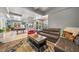 Comfortable living area with sectional sofa, coffee table, and access to game room at 125 Hillcrest Trce, Fayetteville, GA 30215