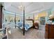 Spacious main bedroom with large windows and four-poster bed at 125 Hillcrest Trce, Fayetteville, GA 30215