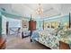 Main bedroom with four-poster bed and access to upper floor at 125 Hillcrest Trce, Fayetteville, GA 30215