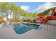 Inviting in-ground pool with a deck and a waterslide at 125 Hillcrest Trce, Fayetteville, GA 30215