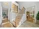 Elegant staircase with black spindles and light wood treads at 125 Hillcrest Trce, Fayetteville, GA 30215