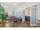 Sunroom with French doors, hardwood floors, and abundant plants at 125 Hillcrest Trce, Fayetteville, GA 30215