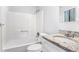 Clean bathroom with granite countertop and tub at 5632 Rock Springs Rd, Lithonia, GA 30038