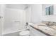 Clean bathroom with granite vanity and tub shower at 5632 Rock Springs Rd, Lithonia, GA 30038