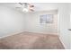 Main bedroom with ceiling fan and neutral decor at 5632 Rock Springs Rd, Lithonia, GA 30038