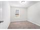 Bright bedroom with neutral walls and carpet at 5632 Rock Springs Rd, Lithonia, GA 30038