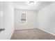 Bright bedroom featuring neutral walls and carpet at 5632 Rock Springs Rd, Lithonia, GA 30038