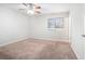 Spacious bedroom featuring ceiling fan and carpet at 5632 Rock Springs Rd, Lithonia, GA 30038