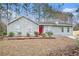 Gray house with red door and stone accents at 5632 Rock Springs Rd, Lithonia, GA 30038