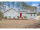 Gray house with red door and stone accents at 5632 Rock Springs Rd, Lithonia, GA 30038