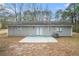 Ranch-style home with a patio and wooded lot at 5632 Rock Springs Rd, Lithonia, GA 30038