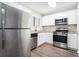 Modern kitchen with stainless steel appliances at 5632 Rock Springs Rd, Lithonia, GA 30038