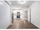 Kitchen area with stainless steel appliances and wood-look floors at 5632 Rock Springs Rd, Lithonia, GA 30038