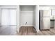 Laundry area with shelving and new flooring at 5632 Rock Springs Rd, Lithonia, GA 30038