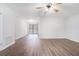Large living area with hardwood floors and door to patio at 5632 Rock Springs Rd, Lithonia, GA 30038