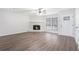 Living room with fireplace and wood-look flooring at 5632 Rock Springs Rd, Lithonia, GA 30038