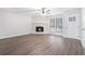 Living room with stone fireplace and hardwood floors at 5632 Rock Springs Rd, Lithonia, GA 30038