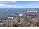 Aerial view showcasing home's location near golf course and reservoir at 1608 Woodcliff Ne Dr, Atlanta, GA 30350