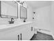Modern bathroom with double vanity and hexagon tile floors at 1608 Woodcliff Ne Dr, Atlanta, GA 30350
