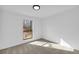 Bright bedroom with large window and neutral carpet at 1608 Woodcliff Ne Dr, Atlanta, GA 30350