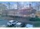 Two-story condo building with balconies and parking at 1608 Woodcliff Ne Dr, Atlanta, GA 30350