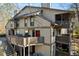 Townhouse exterior with a deck and surrounding trees at 1608 Woodcliff Ne Dr, Atlanta, GA 30350