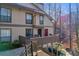 Attractive exterior of a townhouse with a deck and wooded views at 1608 Woodcliff Ne Dr, Atlanta, GA 30350
