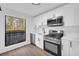 Modern kitchen with stainless steel appliances and wooded views at 1608 Woodcliff Ne Dr, Atlanta, GA 30350