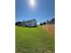 Large backyard with well maintained lawn and wood fence at 575 Dunagan Dr, Lawrenceville, GA 30045